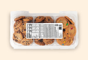 Assorted cookie packs in a clear container Assorted cookie packs in a clear container, including chocolate chip and M&M cookies