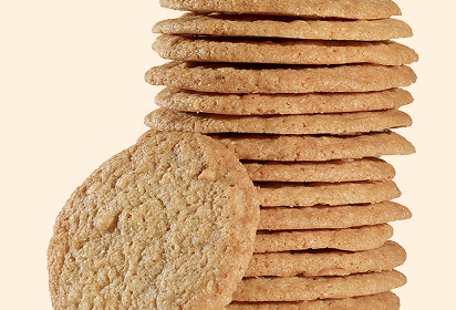 Thin toasted almond cookies Close up view of stacked thin toasted almond cookies