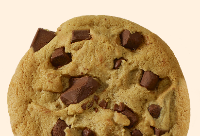homemade oatmeal cookie Close-up of a homemade oatmeal cookie with raisins, featuring a golden-brown color and a chewy texture