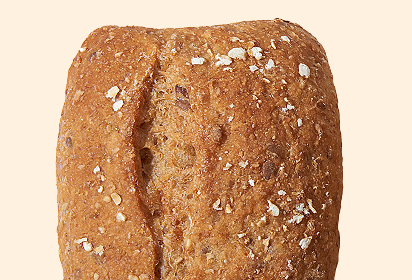 rustic multi grain dinner rolls Close-up of rustic multi grain dinner rolls bread topped with oats and a cracked crust