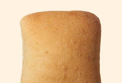 warm, soft white dinner rolls Close-up of a warm, soft white dinner rolls - golden-brown loaf of bread